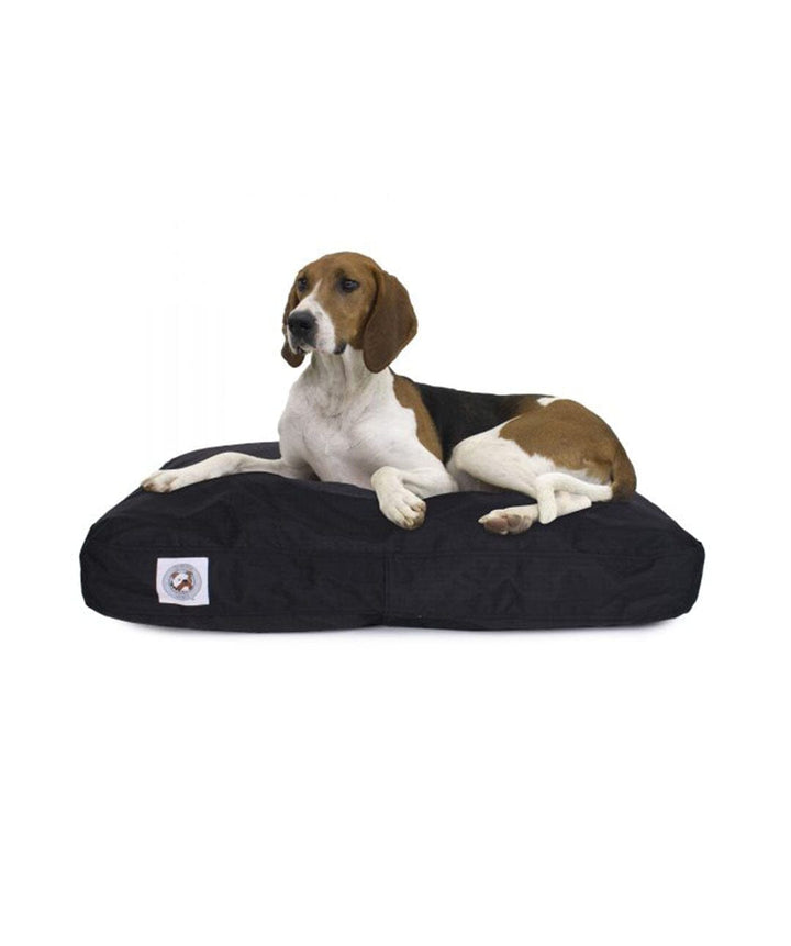 Large dog laying on black dog bed